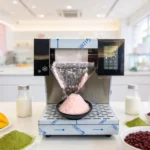 Colorful tropical mango snow ice bowl made with a professional Bingsu machine.